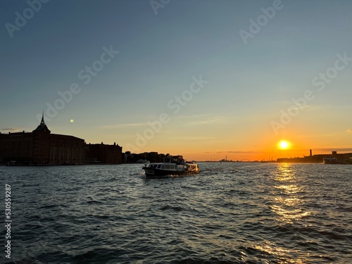 Water taxi and sunset over Venice 