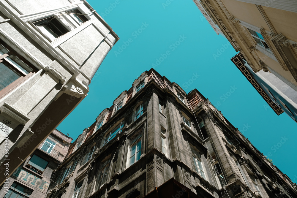 Beautiful view with old buildings and blue sky in Karakoy, historical aesthetic structures in Istanbul, landscape with buildings with clear sky, cityscape from Istanbul, travel and explore idea