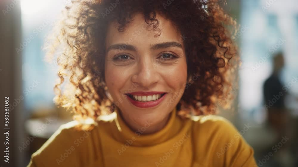 Close Up Portrait of a Beautiful Multiethnic Arab Woman with Brown Eyes and Curly Hair. Cheerful Young Female with a Big Smile Enjoying Life, Success and Empowerment. Close Up Portrait of a Beautiful Multiethnic Arab Woman with Brown Eyes and Curly Hair. Cheerful Young Female with a Big Smile Enjoying Life, Success and Empowerment.