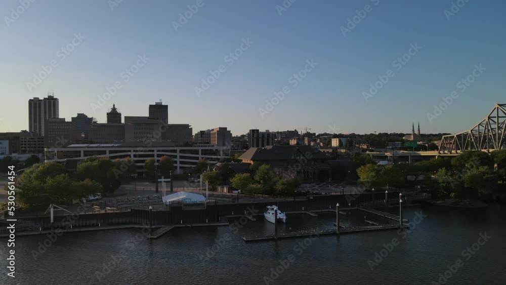 An aerial panoramic introduction to downtown Peoria, Illinois, and the surrounding riverfront at the golden hour. An aerial panoramic introduction to downtown Peoria, Illinois, and the surrounding riverfront at the golden hour.