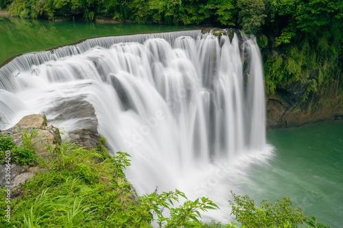 Turquoise streams  green bushes  waterfall views. Refreshing natural landscape. Taiwan