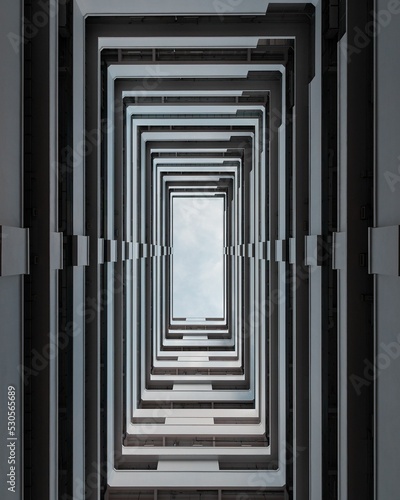 Vertical shot of balconies and floors of a building photo