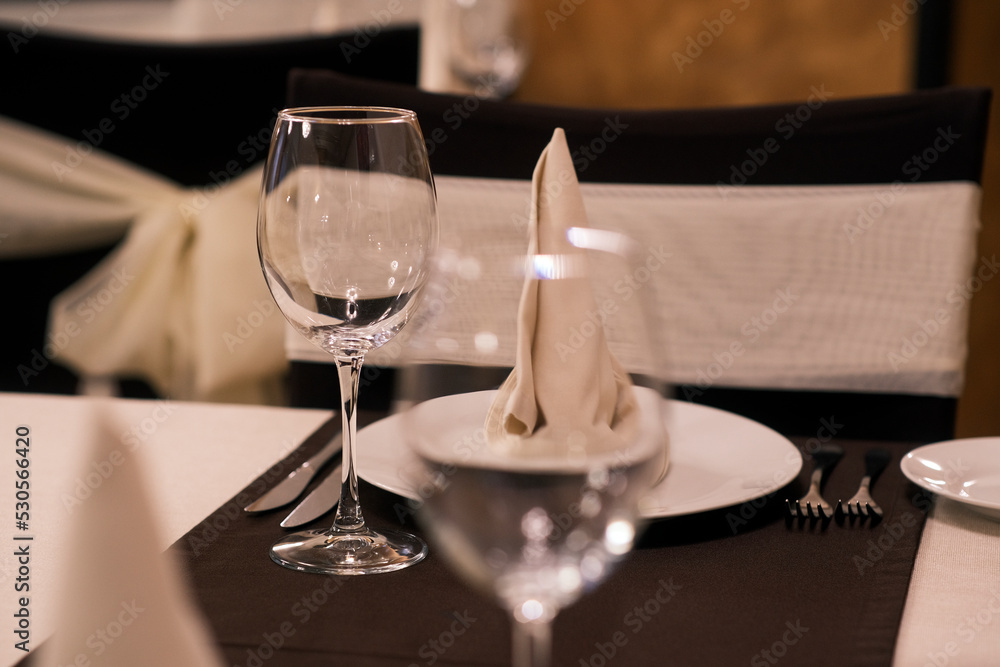 Banquet table with wineglasses. High angle of elegant banquet table served for wedding celebration Banquet table with wineglasses. High angle of elegant banquet table served for wedding celebration