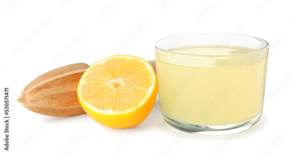 Freshly squeezed juice, half of lemon and reamer on white background Freshly squeezed juice, half of lemon and reamer on white background