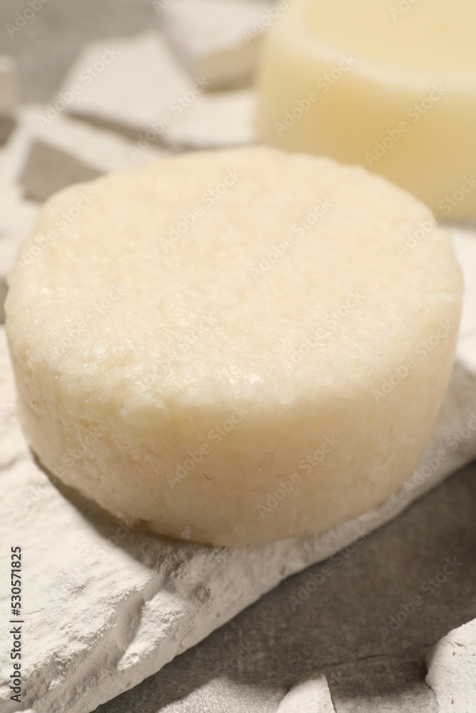 Solid shampoo bars on light grey table, closeup Solid shampoo bars on light grey table, closeup