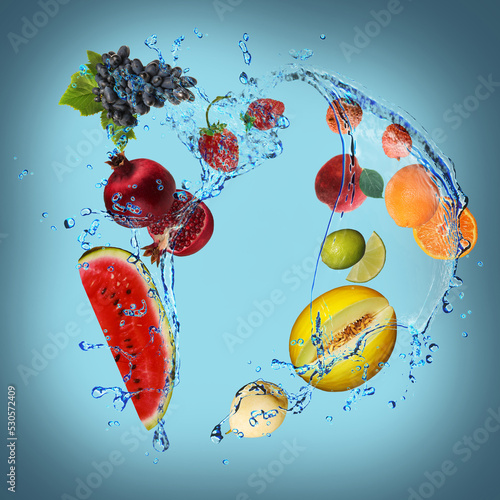 Fototapeta Naklejka Na Ścianę i Meble -  Panorama with fruits in splashes of water - juicy lemon, grapes, melon, banana, pomegranate, strawberry, lime, pear, peach are full of vitamins and are very beneficial for our health