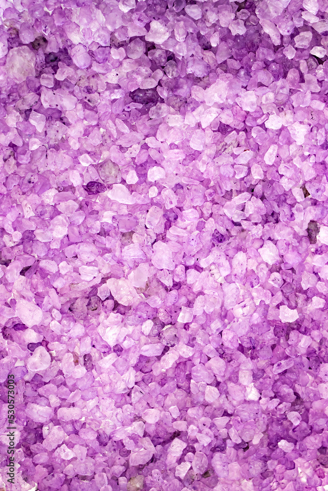 Texture of sea lavender salt in close-up. Body treatment, skin care concept. Flat lay.