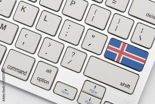 national flag of iceland on the keyboard on a grey background .3d illustration
