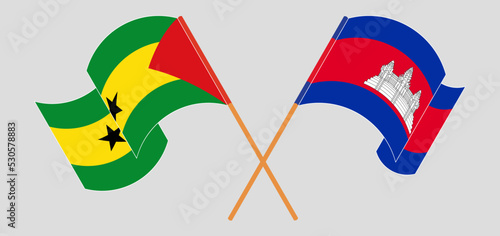 Crossed and waving flags of Sao Tome and Principe and Cambodia