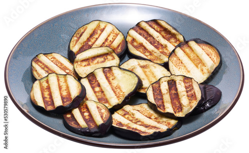 Slices of eggplant roasted on a grill with stripes from a grill isolated