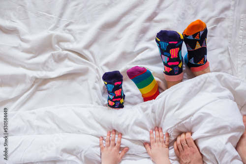 Obraz na płótnie Colorful socks on feet as a symbol of World Down Syndrome Day. w salonie