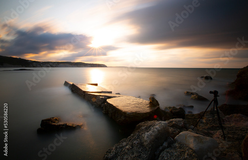 Harbor under İnceburun lighthouse, basalt cliffs photographed with long exposure technique photo