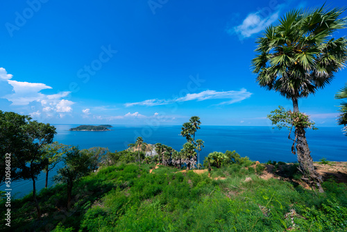 Promthep Cape is one of the most photographed locations in Phuket. Phromthep cape viewpoint at blue sea sky in Phuket, Thailand. © gee1999
