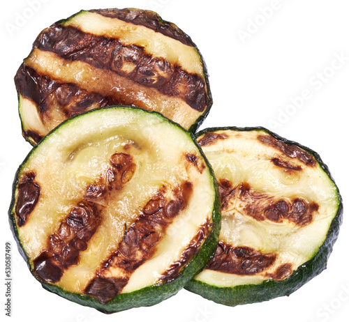 Slices of zucchini roasted on a grill with stripes from a grill isolated