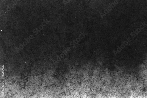 black and white texture of old paper with water stains as a background.