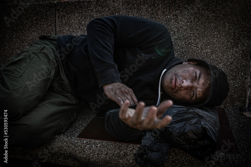 Obraz na plátně Asian man is homeless at the side road,A stranger has to live on the road alone because he has no family
