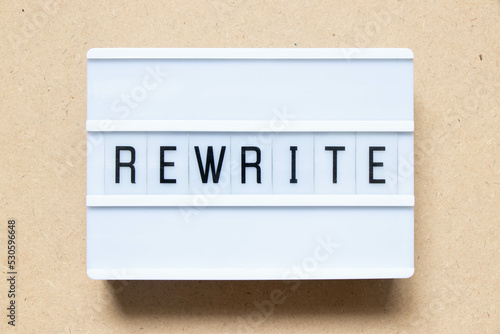 Lightbox with word rewrite on wood background