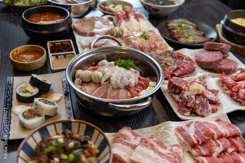 Korean traditional style assorted bbq grilled set, fresh Asian side dish vegetables, and shabu-shabu