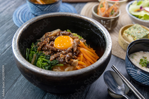 Korean traditional food Bibimbap in a hot stone pot