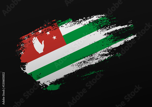 Abstract creative patriotic hand painted stain brush flag of Abkhazia on black background