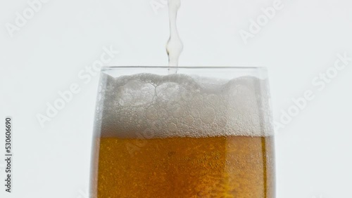 Wallpaper Mural Pouring hoppy liquid glass closeup. Unfiltered barley beer stream filling goblet Torontodigital.ca