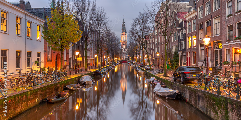Panorama of Amsterdam canal Groenburgwal with Zuiderkerk, southern church, Holland, Netherlands.
