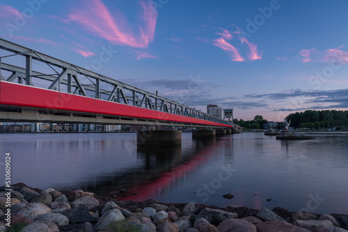 Obraz na plátně The Cultural Bridge - a train and pedestrian bridge in Aalborg, Denmark, during