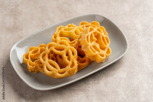 Kembang Goyang or shaking flower, Indonesian typical homemade crispy fried snack in flowers shape and typical of Betawi Snack.