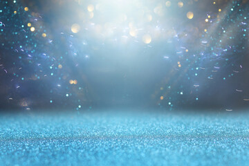 background of abstract glitter lights. silver, blue and black. de focused