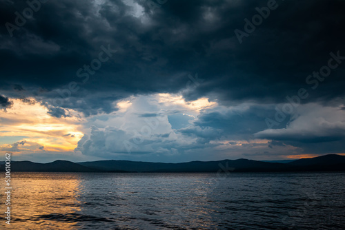 Cloudy evening before rain on a picturesque lake