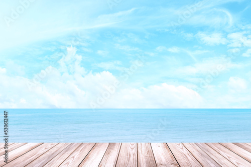 Empty wooden table for displaying products. The background is sea view  blue sky  white clouds.  with copy space 