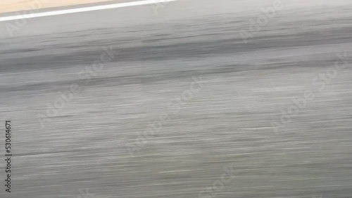 Closeup of asphalt road with fast movement