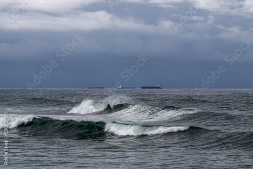 Ships on the horizon before rain