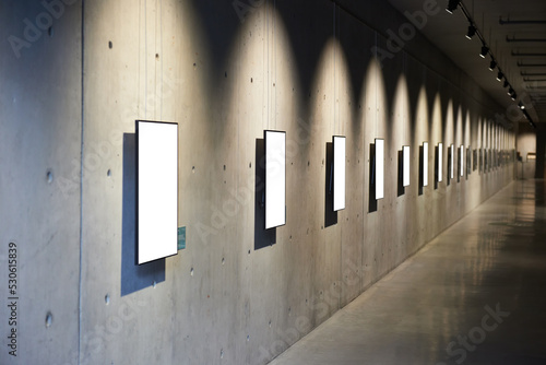 Empty blank white isolated frame on wall