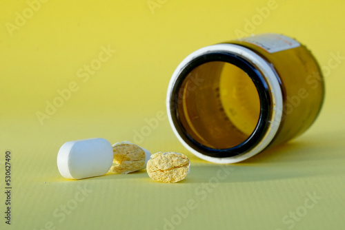 Wallpaper Mural Pharmaceutical medicine pills, tablets and bottle on yellow background. healthcare concepts Torontodigital.ca
