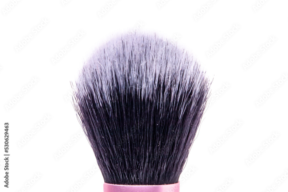 Selective focus on purple clean professional makeup brush isolated on white. Concept beauty.Macro.
