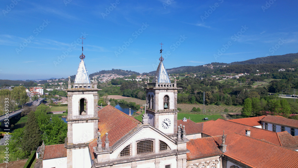 Fototapeta premium Aerial view of the Monastery of St. Benedict (Sao Bento) in the city of Santo Tirso, Portugal, with the Ave River in the background. Benedictine order.