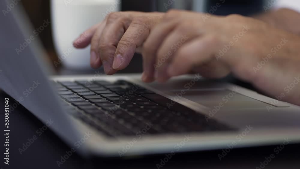 Adult businessman typing on laptop keyboard. Male blogger hands busy typing on computer to writing content or article to web blogs for internet marketing Adult businessman typing on laptop keyboard. Male blogger hands busy typing on computer to writing content or article to web blogs for internet marketing