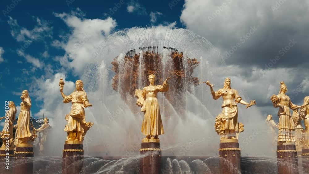 Fountain Friendship of peoples, golden female statue figures are symbols of USSR nations. Soviet Union era complex VDNKh, All-Russian exhibition center VDNH, recreational city park in Moscow, Russia.