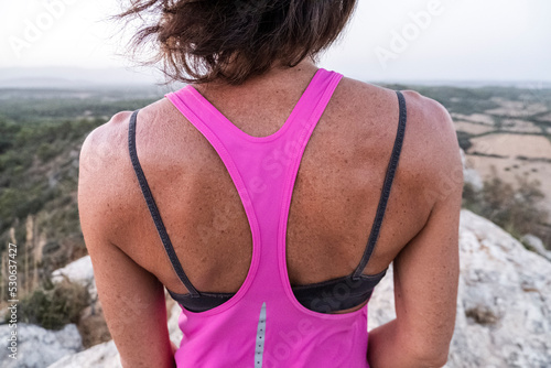 strong back of a middle-aged woman, Puig de Ses Bruixes, Llucmajor, Majorca, Balearic Islands, Spain photo