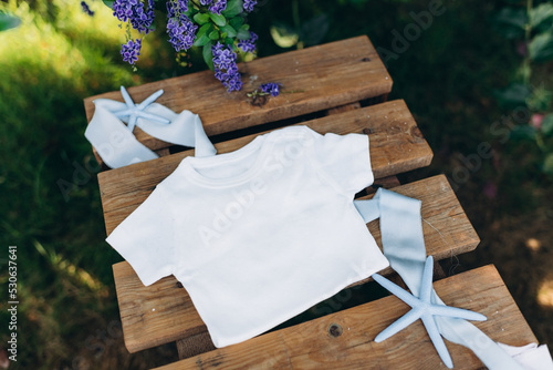 white baby clothes mockup with starfish photo