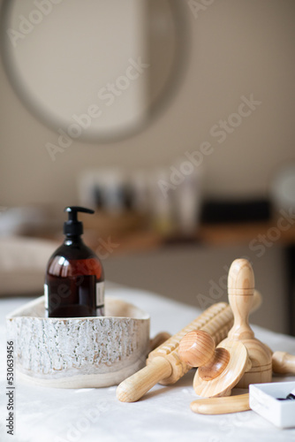 massage table prepared with oils and wood therapy photo