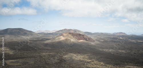 Volcanoes, black lava and islets of Lanzarote seen from Caldera Blanca © roberto