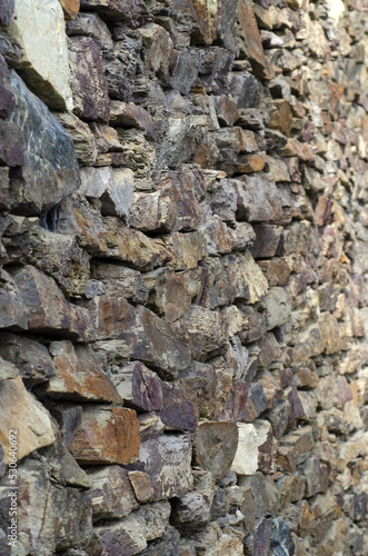 stone wall texture composed of various colored stones