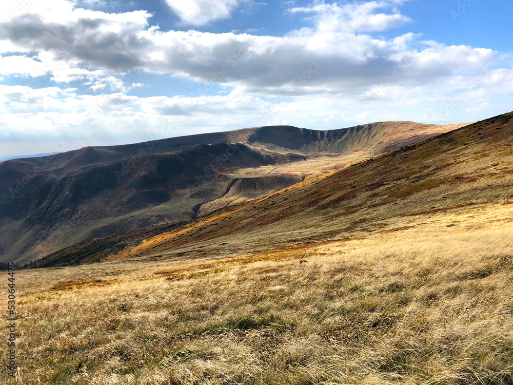 landscape with mountains and blue sky in the autumn