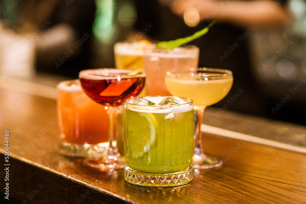 Selection of cocktails on a bar counter Selection of cocktails on a bar counter