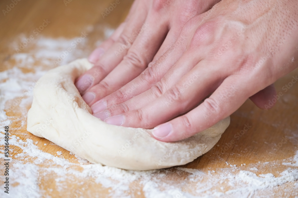 Нands and fingers of a person making pizza Нands and fingers of a person making pizza
