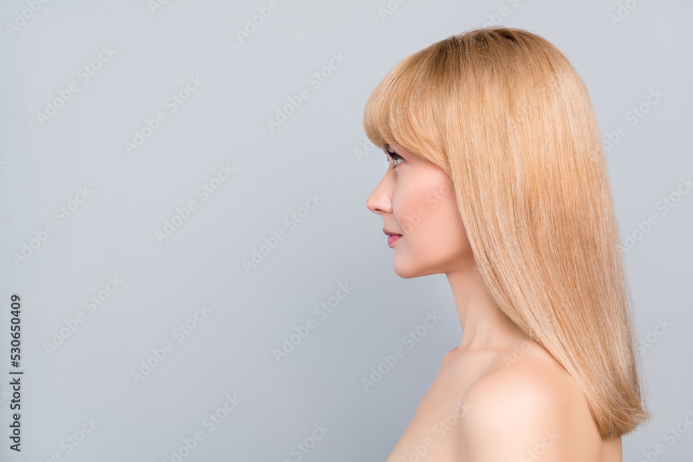 Profile side view portrait of attractive gorgeous well-groomed woman perfect skin copy space advert isolated on grey pastel color background Profile side view portrait of attractive gorgeous well-groomed woman perfect skin copy space advert isolated on grey pastel color background