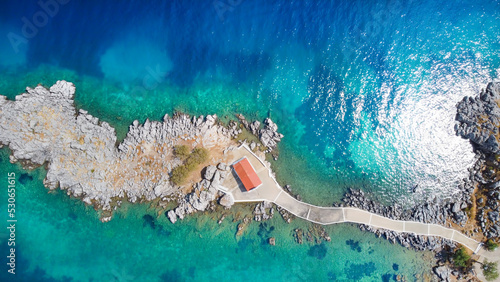 Authentic traditional Greek islands- unspoiled Chios, little church in the sea over the rocks Agios Isidoros. Eastern Aegean islands