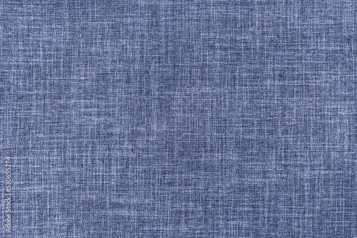 Texture of natural upholstery fabric or cloth. Fabric texture of natural cotton or linen textile material. Blue canvas background. Decorative fabric for curtain, furniture, walls, clothes